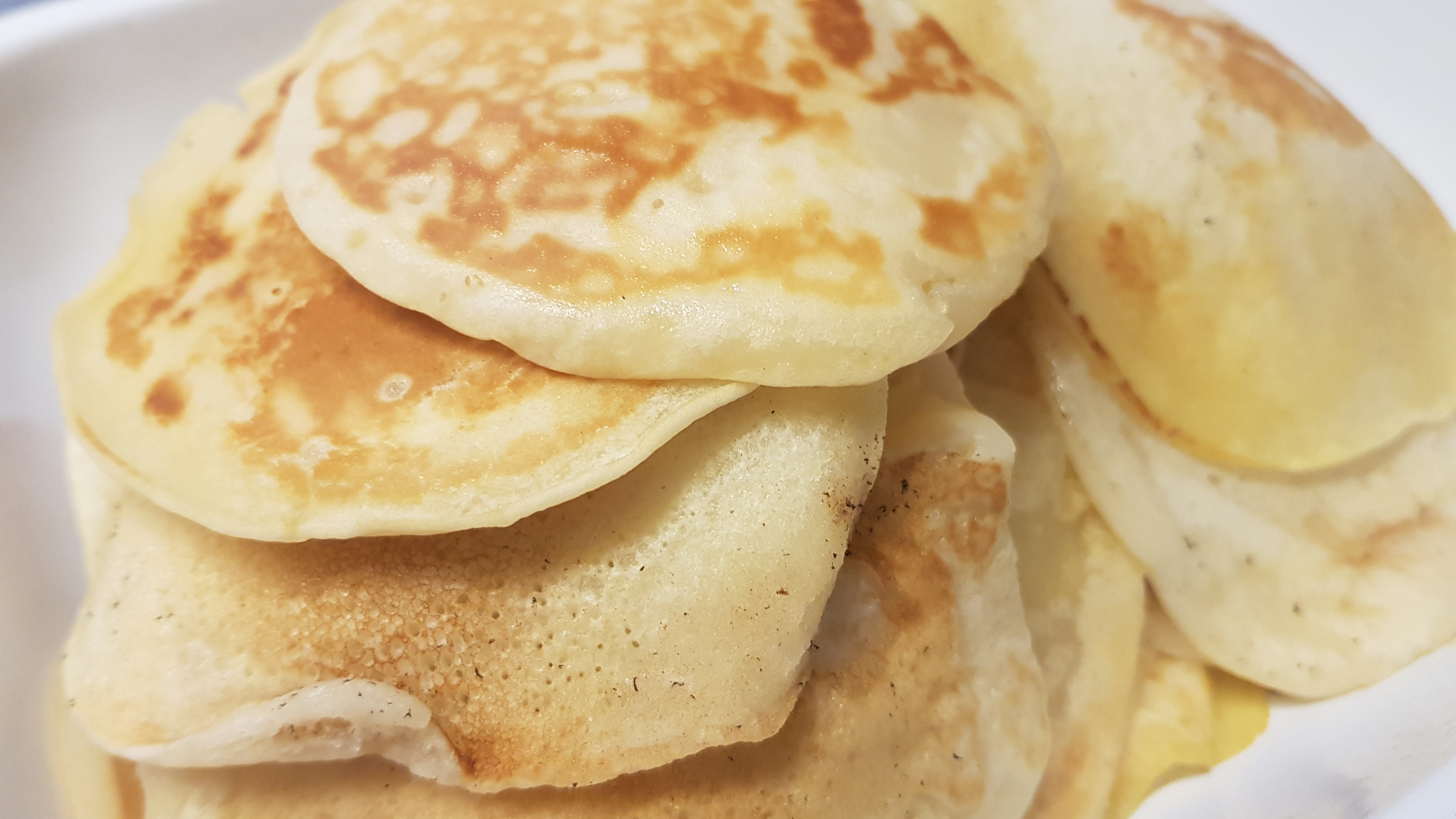 an abundant heaped pile of warm pancakes